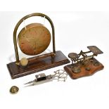 A brass gong together with a set of brass postal scales, a further part set of brass weights and a