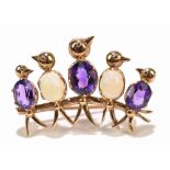 A novelty yellow metal amethyst and opal brooch modelled as four birds seated upon a branch,