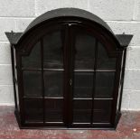 A Dutch style domed topped hanging glazed two door wall cabinet.