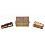 A 9ct rose gold and guilloche enamel Art Deco cheroot holder with amber tip, with Greek key