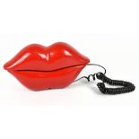 A retro telephone modelled as a pair of red lips.