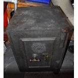 JOHN LOWE OF MANCHESTER; a cast iron safe with key, height 61cm, width 47cm, depth 49cm.