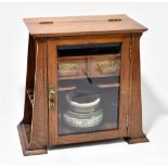 An oak Arts & Crafts smoker's cabinet.