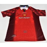 ERIC CANTONA; an Umbro Manchester United 1996-1998 season retro reproduction home shirt, signed to