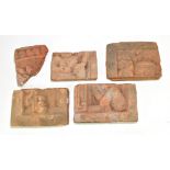 Four 14th/15th century Javanese Majapahit Kingdom terracotta panels and a similar fragment, each