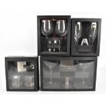 DARTINGTON; four boxed sets of various drinking glasses including two spirit tumblers and hip flask,
