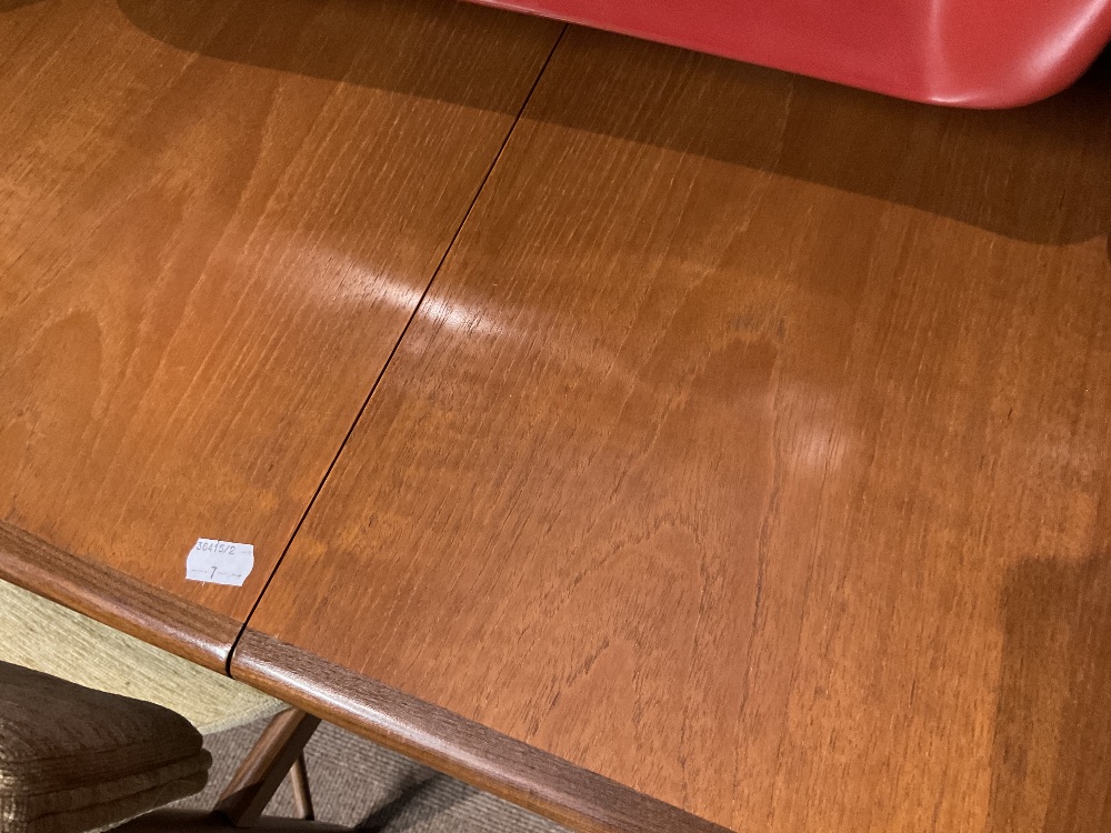 G-PLAN; a mid-century teak extending dining table, raised on turned column supports, with additional - Image 9 of 12