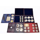 A group of modern commemorative coins relating to the Royal family, including a set of ten Queen's