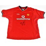 DAVID BECKHAM; an Umbro Manchester United 2000 shirt, signed to the front, size LB.Additional