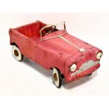 TRI-ANG; a pressed steel child’s pedal car, English 1960s, painted in red with white metal