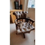 Leather office chair. olive green/brown, buttoned leather, rotating. Condition. Overall good but