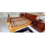 A large Sleigh bed frame. Cherry and maple. Part assembled. Condition excellent.