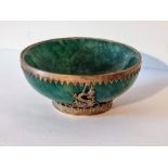 A Chinese jade bowl with cast metal decoration. Diameter 11cm.