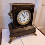 Slate mantle clock with inlaid decoration on decorative brass feet (front) and gothic side