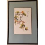 Embroidery in a frame of Chinese birds in trees