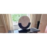 Art Deco style lamp, mother of pearl marbled effect mounted disk on a black base, 70 x 65cm ,