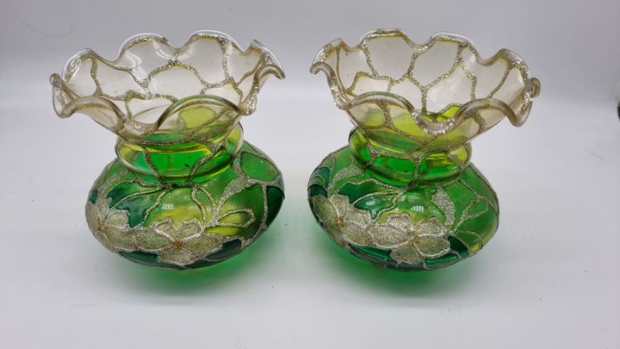 Pair of hand painted green glass vases floral design. Condition. No signs of damage or repair