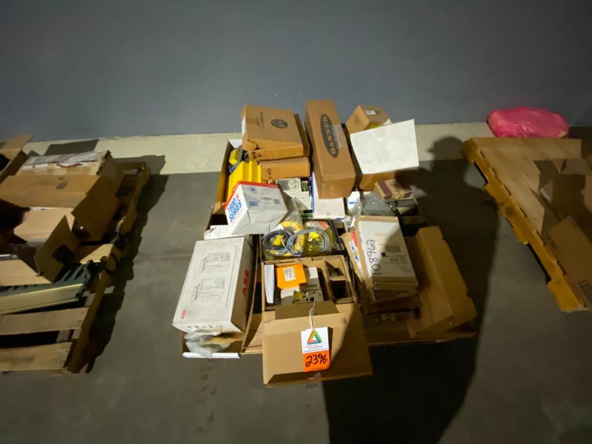 pallet of ABB parts, controllers, cabinets, and control boards