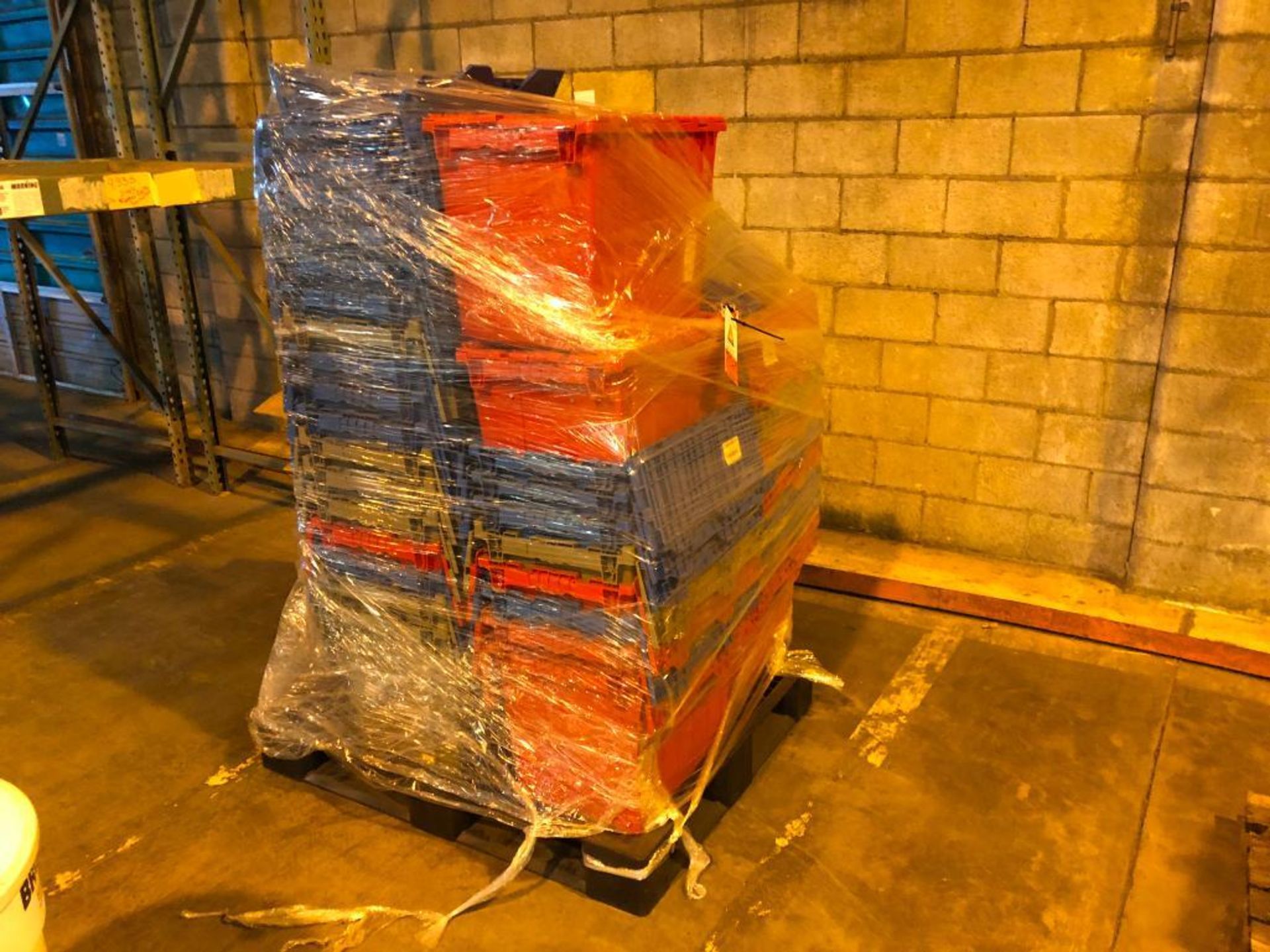 pallet of assorted plastic storage bins