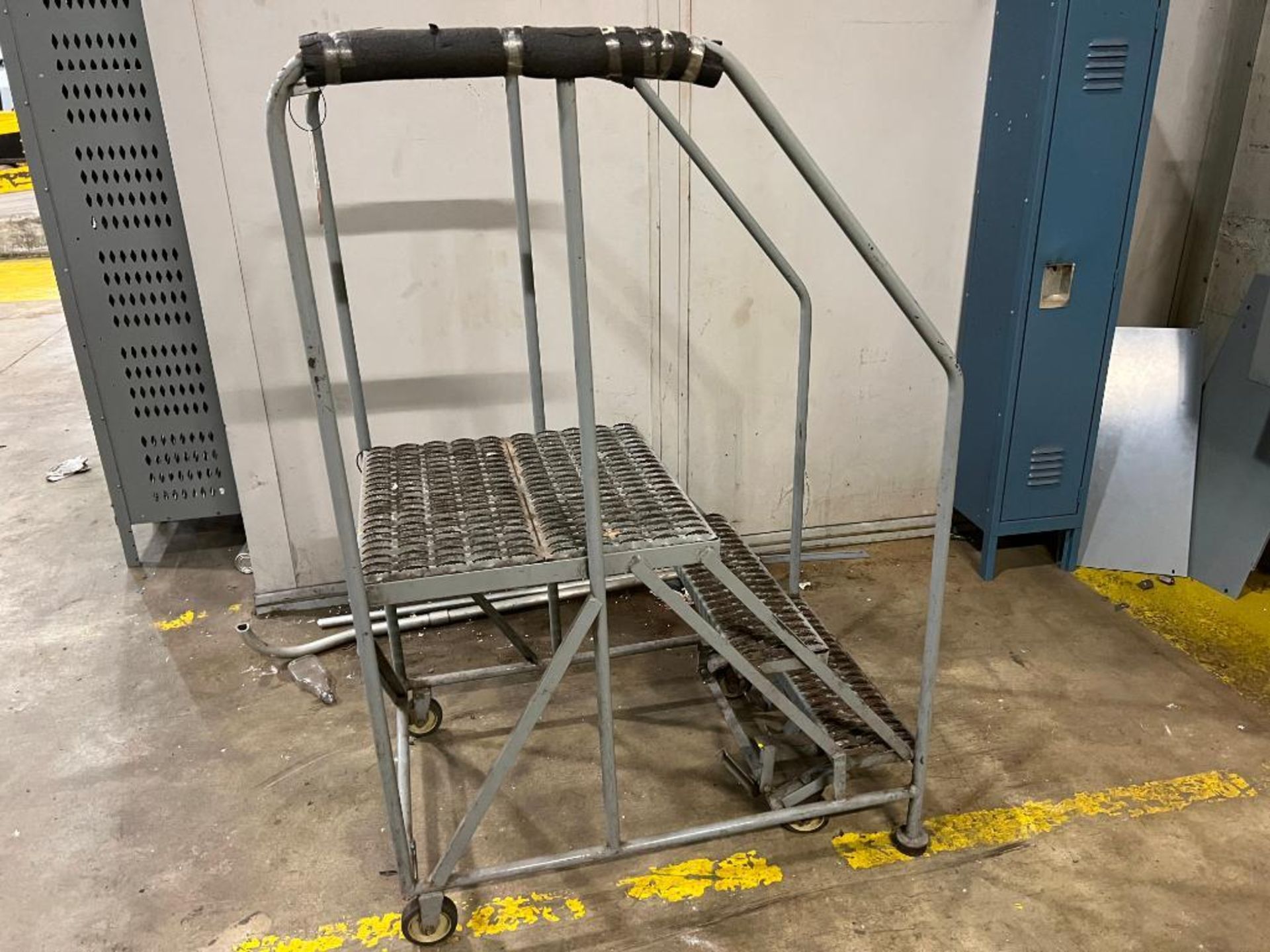 Cotterman 3-step rolling warehouse ladder, includes blue locker and 3-locker bank