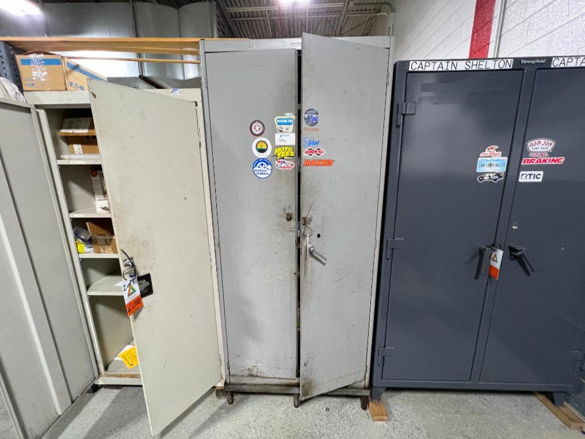 (4) 2-door storage cabinets with contents; (1) shelving unit with contents