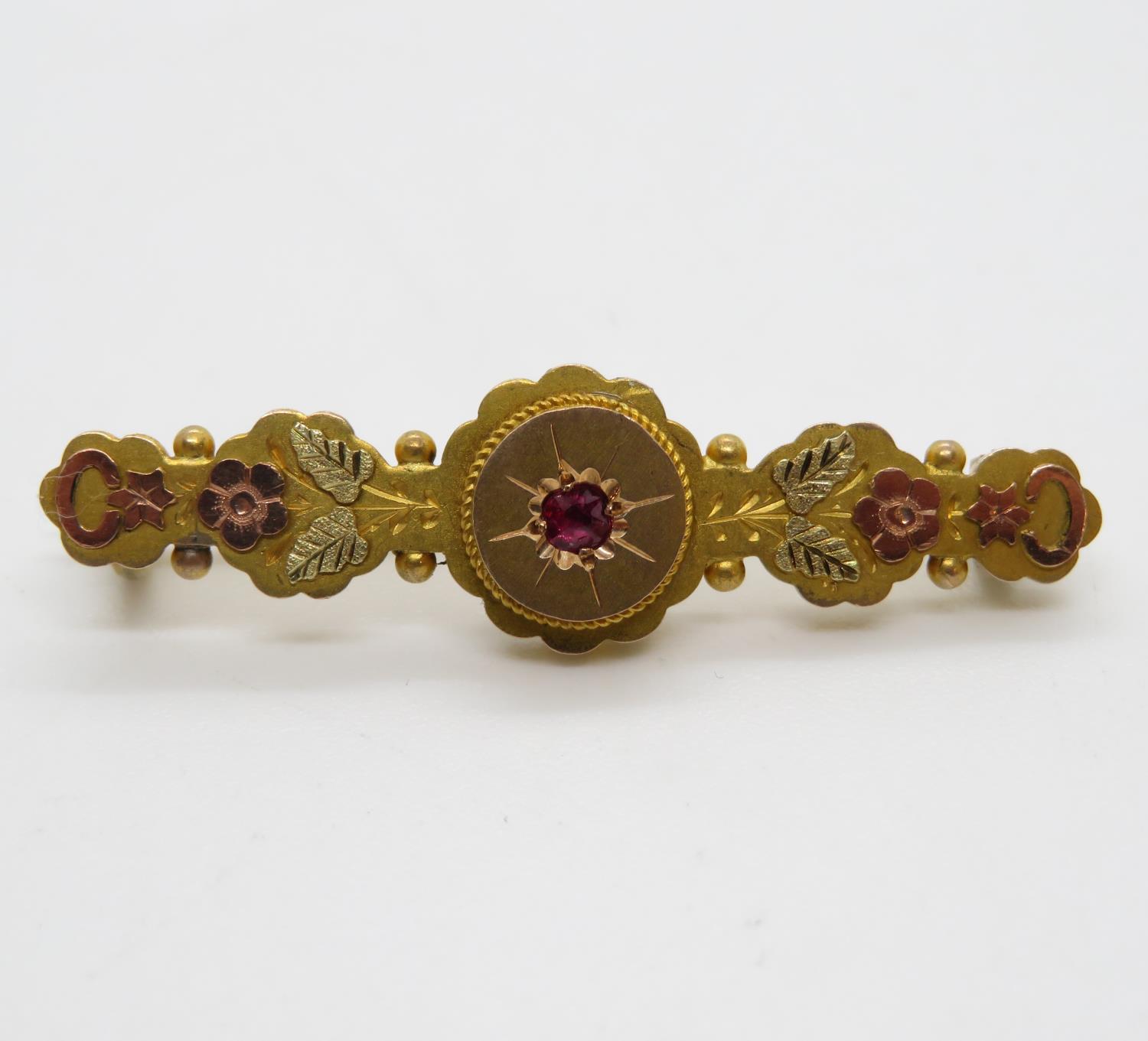 Victorian ruby brooch with applied rose and yellow gold floral decor Birmingham 1888HM