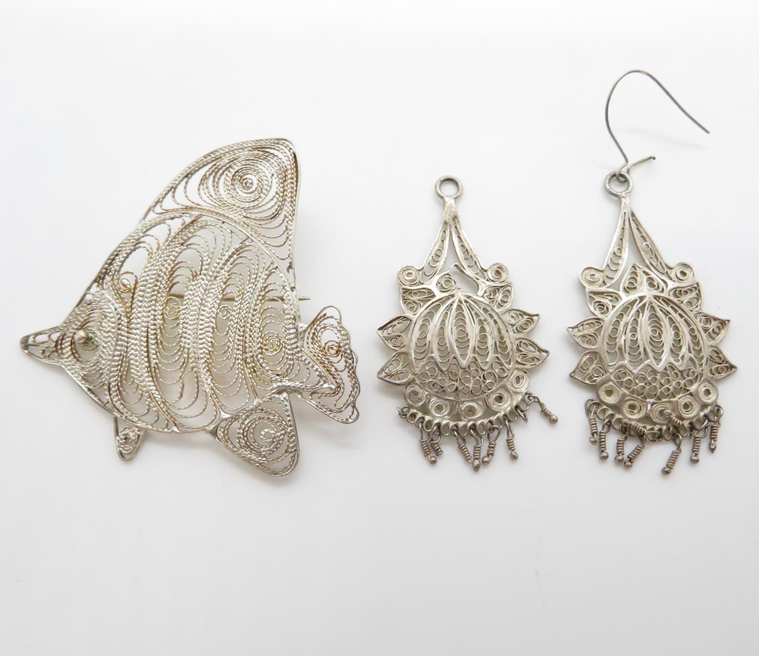 Silver filigree brooches and earrings