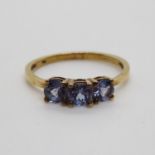 9ct gold ring 1.6g size O with possibly Tanzanite stones