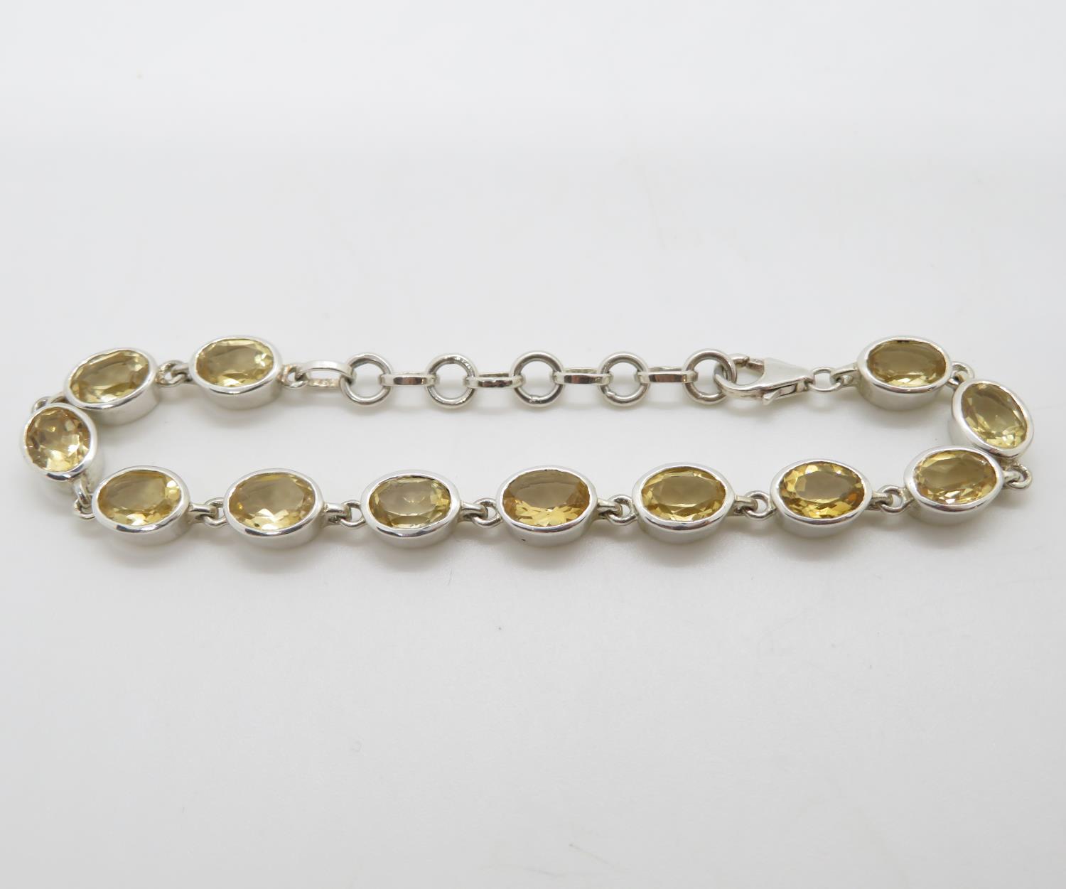 Vintage silver bracelet set with 12 citrines 8" 14.5g