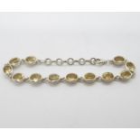 Vintage silver bracelet set with 12 citrines 8" 14.5g