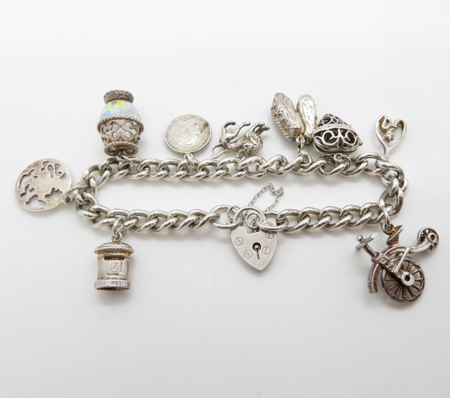 Vintage silver charm bracelet with 9x charms London 1978HM 52g