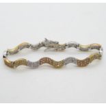 Silver wave bracelet set with CZ stones and alternate gold plated links 7.25" 14.5g