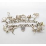 Silver charm bracelet with 13x charms including Martian from Smash advert Birmingham 1978 38.5g