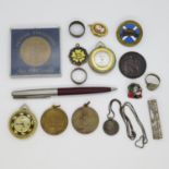 Box with misc. silver coins, jewellery, tokens and enamel badges, also back and front locket