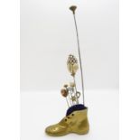 Brass Boot shaped pincushion with x8 lapel pins and hat pins
