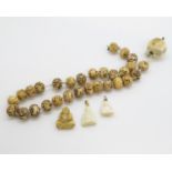 Selection of Victorian carved miniature Buddhas and carved beads