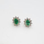 Good pair of 18ct emerald and diamond earrings