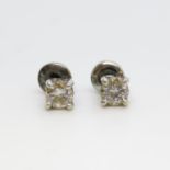 Pair of 18ct white gold diamond earrings - each diamond .25ct