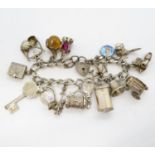 Charm bracelet in silver - lots of charms 66g