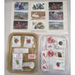 Collection of Isle of Man TT badges unopened, keyrings and phone cards