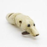 Early bone dogs head whistle with glass eyes