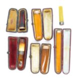 6x cheroot holders mostly amber and gold (5x are boxed)