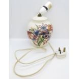 Early Moorcroft lamp with large crack from base up