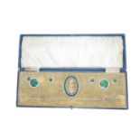 Set of enamelled and yellow metal buttons, buckle and hat pins in leather case