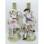 2x porcelain figures marked R to base candleholders to back 11" high