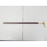 Early walking cane twisted design with ivory handle and gold plated grip and ivory ferrule