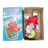 Skippy the Tricky Cyclist tin plate clown clockwork with key - fully workiing