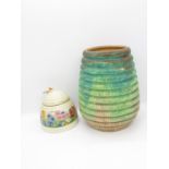 2x Clarice Cliff pieces - one vase with crack 7" high and one Newport Pottery Honey Pot 3.5" no