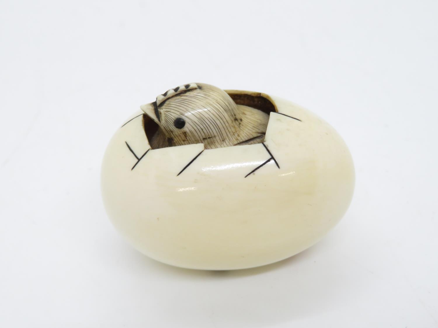 Ivory hand carved 2" netsuke of chicken emerging from egg - fully signed to base