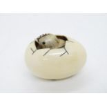 Ivory hand carved 2" netsuke of chicken emerging from egg - fully signed to base